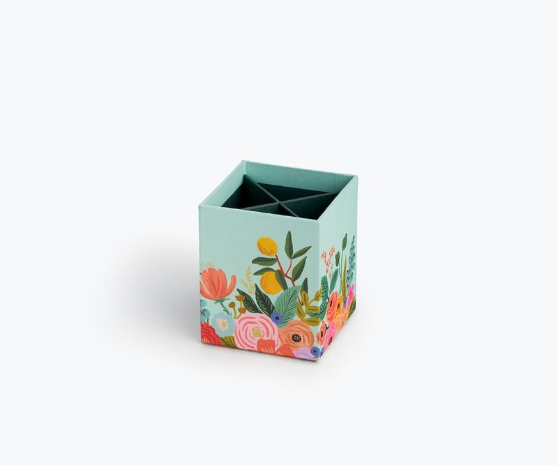 For a fresh take on floral arrangements, choose desk accessories with a festive garden theme.
Courtesy of Rifle Paper Co.