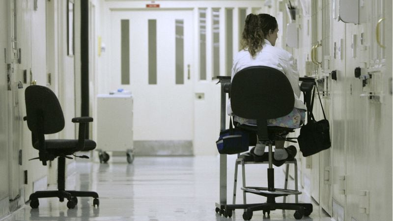 A  medical worker keeps a vigil outside the isolation cell of an inmate on suicide watch at the California State Prison-Sacramento in Folsom in this March 2008 photo. The chief psychiatrist for California's prison system alleged in a report made public Oct. 31, 2018, that state officials have provided inaccurate or misleading information to a federal judge and inmates' attorneys, giving the false impression that the system is properly caring for mentally ill inmates. U.S. District Judge Kimberly Mueller, who oversees mental health care in California's prisons as part of an ongoing federal lawsuit, said she plans to hear public testimony from the whistleblower.