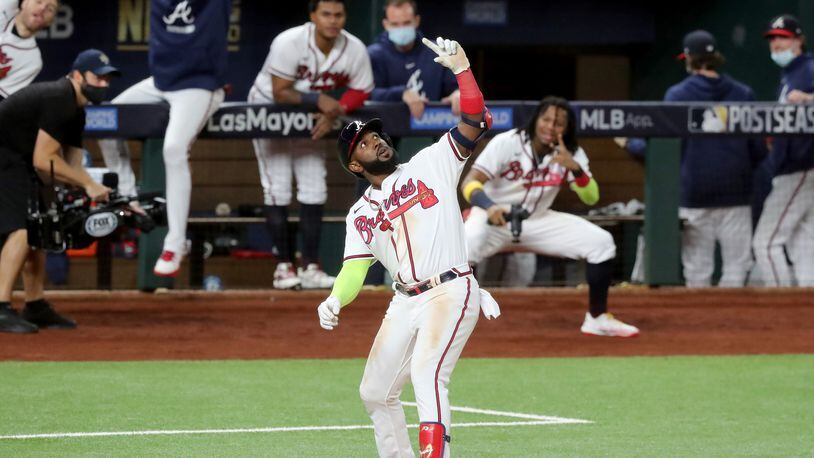 The Braves Marcell Ozuna strikes a pose for a make-believe selfie after his second home run of Thursday night against the Dodgers. (Curtis Compton/Atlanta Journal-Constitution/TNS)