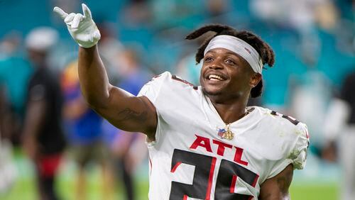 Atlanta Falcons running back Javian Hawkins (25) smiles as walks off the field after exhibition game loss to the Miami Dolphins Saturday, Aug. 21, 2021, in Miami Gardens, Fla. (Doug Murray/AP)