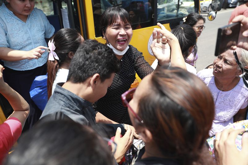 Released prisoners are welcomed by family members and colleagues after they were released from Insein Prison Wednesday, April 17, 2024, in Yangon, Myanmar. On Wednesday Myanmar's military government granted amnesty for over 3,000 prisoners to mark this week’s traditional New Year holiday. (AP Photo/Thein Zaw)