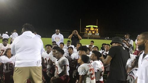 Maurice Dixon addresses his Creekside football team after their 19-14 win at Grayson on Aug. 20, 2021.
