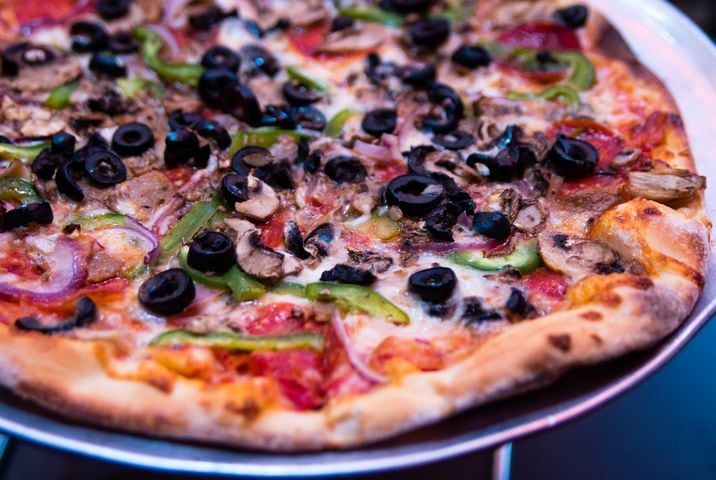 The Kitchen Sink Pizza at Urban Pie is a local take on the classic supreme pie. CONTRIBUTED BY HENRI HOLLIS