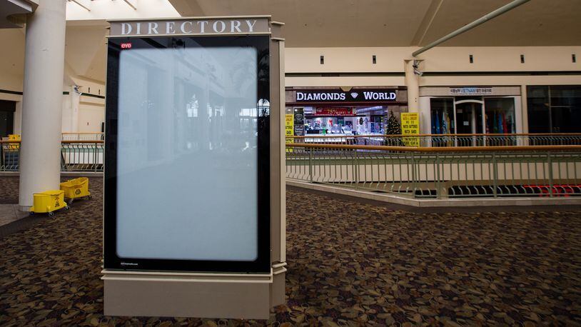 Gwinnett Place Mall is nearly empty of stores and shoppers with many entrances locked Wednesday, Dec 23, 2020.  The mall is being purchased by Gwinnett County, and is working on redevelopment plans for the neglected space.  (Jenni Girtman for The Atlanta Journal-Constitution)