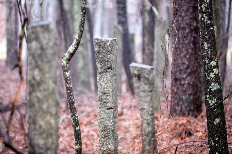 A University of Georgia study recently outlined the history and need for preservation of a tract of land in eastern Gwinnett that runs near GA 316.  Original granite fence posts still mark the land and remain long after the fence was needed for cattle.  The area includes about 2,000 acres and includes a farmhouse from 1894, a water well, one of the oldest dirt road in the state and several homesteads where only a chimney or dandelions remain as a marker on Thursday, Feb 3, 2022.  The Rowen Study suggests environmentally conscious development with trails and historical highlights.  (Jenni Girtman for The Atlanta Journal Constitution)