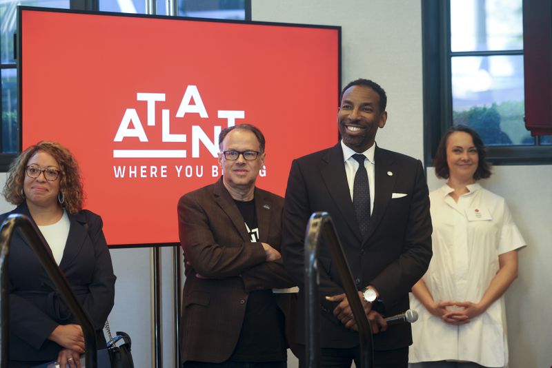 Atlanta Mayor Andre Dickens, second from right, is introduced to speak during the Metro Atlanta Chamber event that announced the new marketing campaign, “Where You Belong,” at the St. Regis Hotel, Monday, April 22, 2024, in Atlanta. (Jason Getz / AJC)
