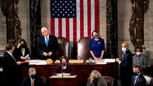 Vice President Mike Pence and House Speaker Nancy Pelosi, D-California, preside over a joint session of Congress convened on Jan. 6, 2021, to certify the Electoral College votes in the 2020 presidential election. A mob of people loyal to then-President Donald Trump stormed the Capitol following a rally that day, halting Congress' counting of the electoral votes to confirm President-elect Joe Biden's victory. (Erin Schaff/The New York Times)