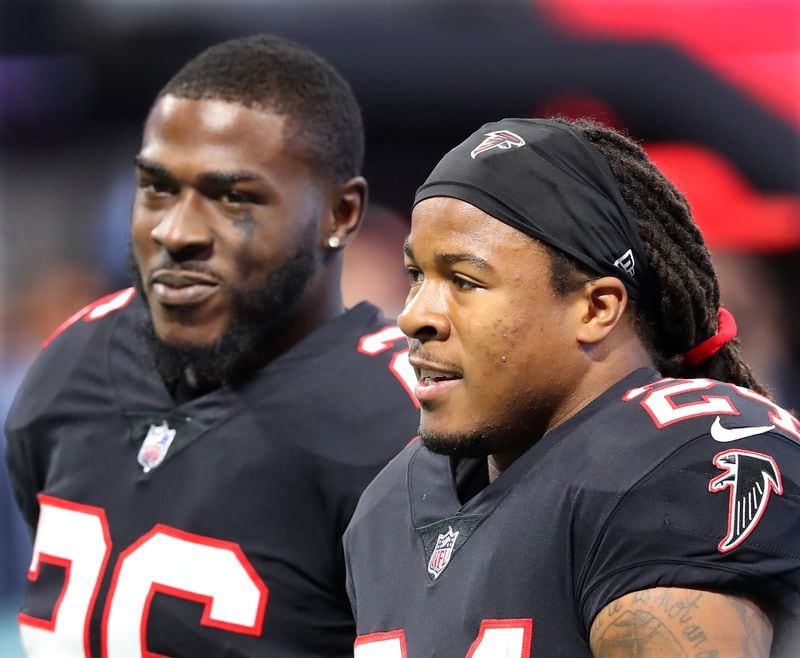 Falcons running backs Tevin Coleman, left, and Devonta Freeman chat it up before a game this season. (Curtis Compton/ccompton@ajc.com)