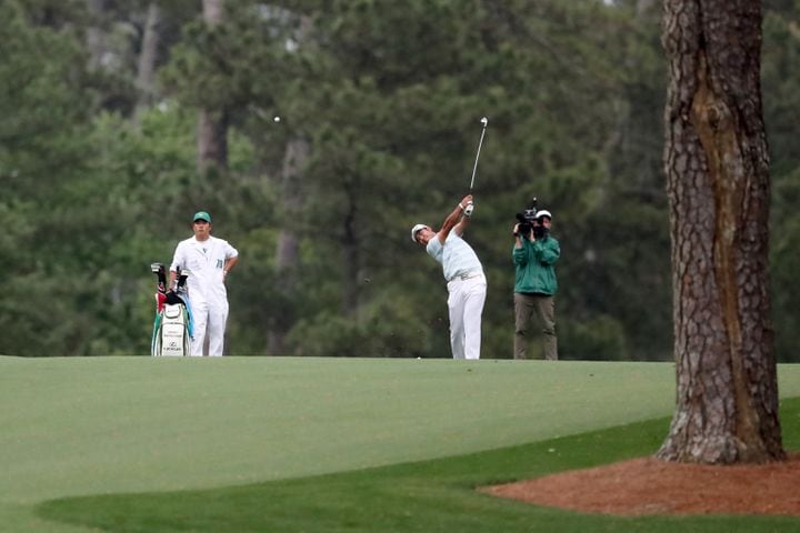 April 10, 2021, Augusta: Hideki Matsuyama hits his fairway shot on the fifteenth hole during the third round of the Masters at Augusta National Golf Club on Saturday, April 10, 2021, in Augusta. Curtis Compton/ccompton@ajc.com