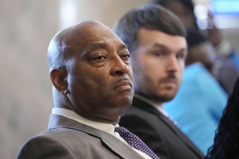 Mississippi state Reps. Robert Sanders, D-Cleveland, left, and Elliot Burch, R-Lucedale, both members of the House Corrections Committee, listen as people speak at a legislative hearing about the difficulties that some former felons face in regaining their right to vote, Wednesday, April 17, 2024, at the Mississippi Capitol in Jackson. (AP Photo/Rogelio V. Solis)