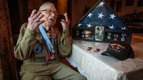 Josiah Benator talks about his time as a WWII soldier and his 60 plus years as a scoutmaster at his Atlanta home Friday, April 7, 2017. Benator received a Purple Heart and a Bronze Star Medal while serving in the WWII, and as a scoutmaster, he has overseen 53 Boy Scouts as they received their Eagle Scout rank. STEVE SCHAEFER / SPECIAL TO THE AJC