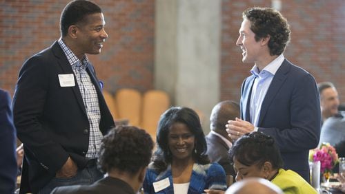 Lee Jenkins (left) of Eagles Nest Church chats with Joel Osteen during the Senior Pastors Atlanta America’s Night of Hope Luncheon at SunTrust Park. (Photo by Phil Skinner)