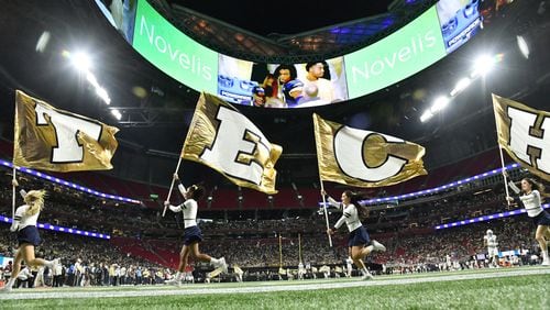 Georgia Tech fans celebrate after quarterback Jeff Sims scored a touchdown during the first half of an NCAA college football game at Mercedes-Benz Stadium in Atlanta on Saturday, September 25, 2021. (Hyosub Shin / Hyosub.Shin@ajc.com)