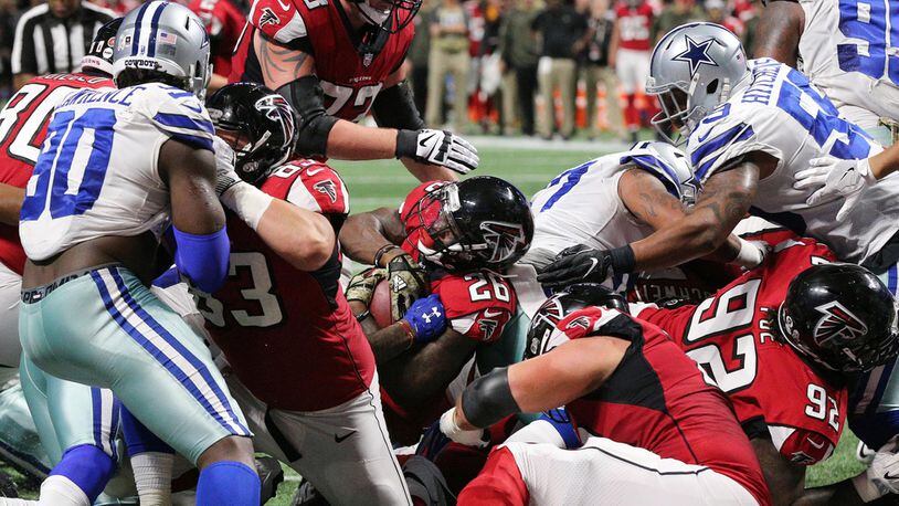 November 12, 2017 Atlanta : Falcons running back Tevin Coleman just gets into the endzone for a 10-7 lead over the Cowboys during the second quarter in a NFL football game on Sunday, November 12, 2017, in Atlanta.    Curtis Compton/ccompton@ajc.com