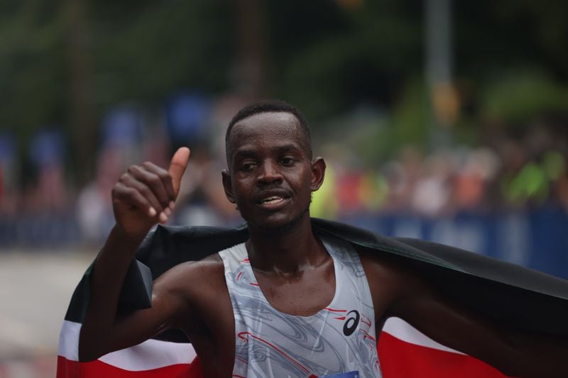 Charles Langat wins the elite men’s division of the 54th running of the Atlanta Journal-Constitution Peachtree Road Race in Atlanta on Tuesday, July 4, 2023.   (Jason Getz / Jason.Getz@ajc.com)