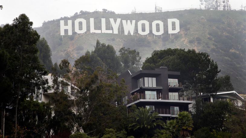 Homes sit on the hillside near the Hollywood Sign. Arriving at the landmark sign that towers magnificently over Los Angeles' skyline requires traipsing through a densely populated hillside neighborhood of 20,000 people and numerous multimillion-dollar homes located on steep, narrow, almost impassable streets. AP/Jae C. Hong