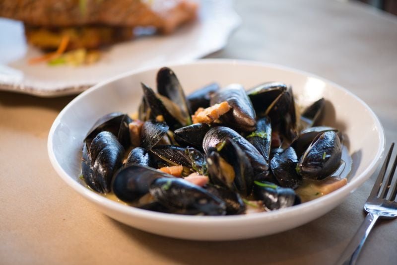 PEI Mussels with pork belly, caramelized onion, and hard cider broth. Photo credit- Mia Yakel.
