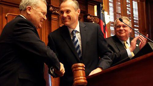 Gov. Nathan Deal (from left) is welcomed to the podium by Lt. Gov. Casey Cagle and House Speaker David Ralston. Staff / 2011 photo