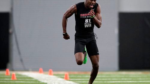 Georgia wide receiver Reggie Davis runs a drill l during pro day at the University of Georgia in Athens, Ga., Wednesday, March 15, 2017. (John Roark/Athens Banner-Herald via AP)