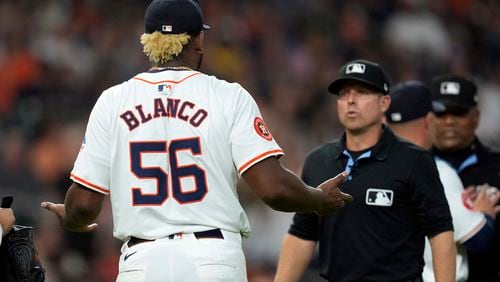 Houston Astros starting pitcher Ronel Blanco (56) talks with second base umpire Tripp Gibson after being ejected following a foreign substance check during the fourth inning of a baseball game against the Oakland Athletics Tuesday, May 14, 2024, in Houston. (AP Photo/David J. Phillip)