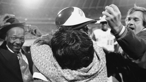 After the Braves won the NL Western Division on Sept. 30, 1969, Ron Reed (right) and Orlando Cepeda expressed their joy in the clubhouse. (AJC file photo)