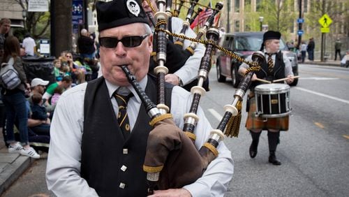 A Scottish Bagpipe Band makes their way up Peachtree Street during the St. Patrickâs Parade in Atlanta Ga Saturday, March 11, 2016. The heavily attended parade preceded the actual holiday this Friday, when, according to a recent national survey, people much prefer wearing green to drinking it. STEVE SCHAEFER / SPECIAL TO THE AJC
