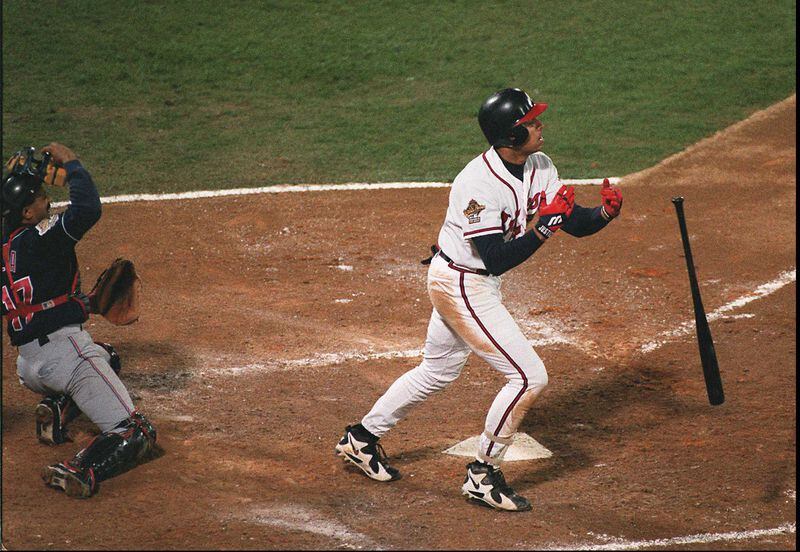 David Justice watches his sixth-inning home run go out of the park as Cleveland catcher Tony Pena watches.