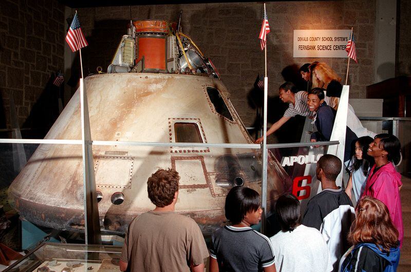 Back in the late 1990s, students examine the Apollo 6 space capsule at Fernbank Science Center. (Phil Skinner/AJC)