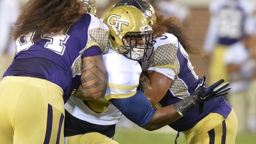 Georgia Tech Yellow Jackets defensive lineman Jabari Hunt (32) gets double coverage by Alcorn State Braves wide receiver Jalen Walker (left) and Alcorn State Braves offensive lineman Toto'a Leilua (right) in the first half of the Georgia Tech season opener against the Alcorn State Braves in Bobby Dodd Stadium on Thursday, September 3, 2015. HYOSUB SHIN / HSHIN@AJC.COM