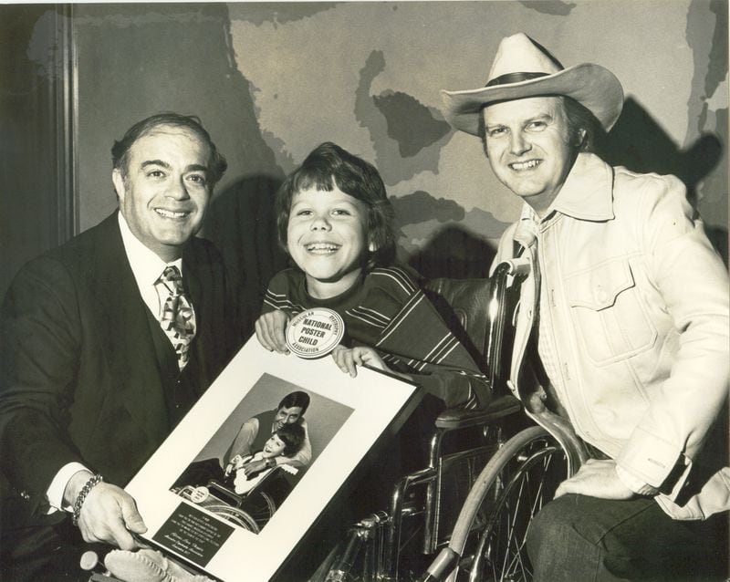 Jerry Blum (left) with a Jerry's kid and Bob Carr (Willis the Guard), a morning show personality on WQXI. CREDIT: File photo from Georgia Radio Hall of Fame, year unknown