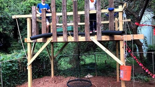 It s a proud moment as Fort Fun is finished for Theodore and James Mulford. Contributed by Douglas Mulford.