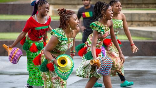 The performing arts collective Egun Omode performs at Centennial Olympic Park for the Juneteenth Atlanta Parade and Music Festival on Saturday, June 19, 2021. (Photo: Steve Schaefer for The Atlanta Journal-Constitution)