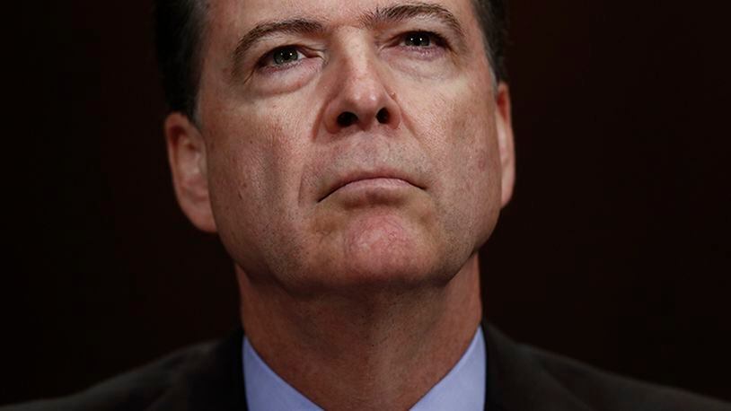 In this Wednesday, May 3, 2017, photo, then-FBI Director James Comey pauses as he testifies on Capitol Hill in Washington, before a Senate Judiciary Committee hearing. President Donald Trump abruptly fired Comey on May 9, ousting the nation's top law enforcement official in the midst of an investigation into whether Trump's campaign had ties to Russia's election meddling.
