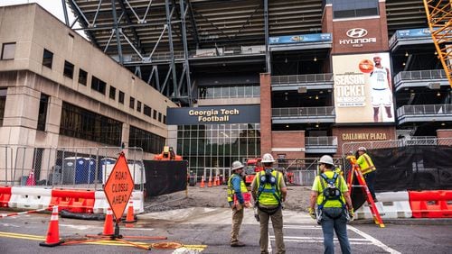 Construction workers prepare for the removal of the stairwell during demolition at Bobby Dodd Stadium on the campus of Georgia Tech Friday, May 10, 2024. (Atlanta Journal-Constitution/Jason Allen)