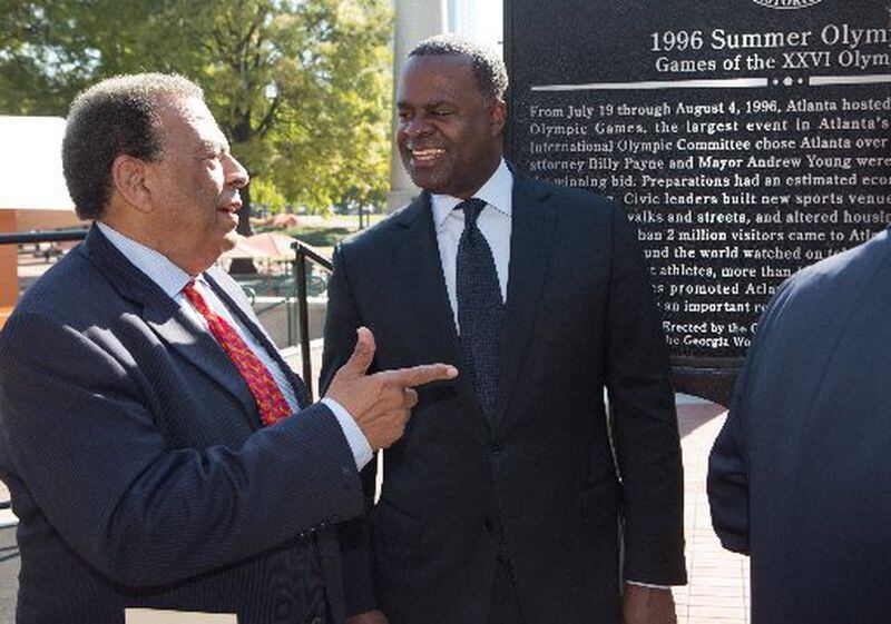 Current Atlanta Mayor Kasim Reed with one of his predecessors, Ambassador Andrew Young, at the dedication of a Georgia Historical Marker commemorating the 1996 Summer Olympic Games in Centennial Olympic Park on Nov. 1. AJC photo: Phil Skinner