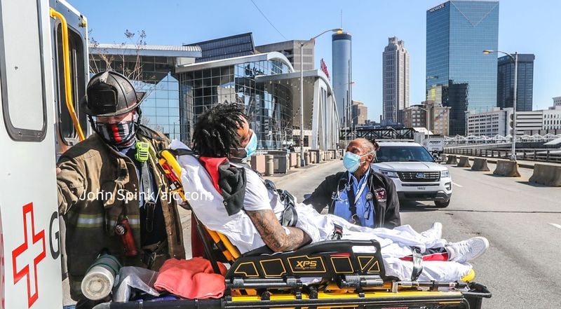 The man was loaded into a waiting ambulance after being removed from the MARTA track Thursday morning.