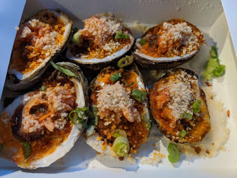 Spicy broiled oysters were on a recent seafood-themed weekend pop-up menu at Salaryman. The theme changes weekly. Courtesy of Paula Pontes