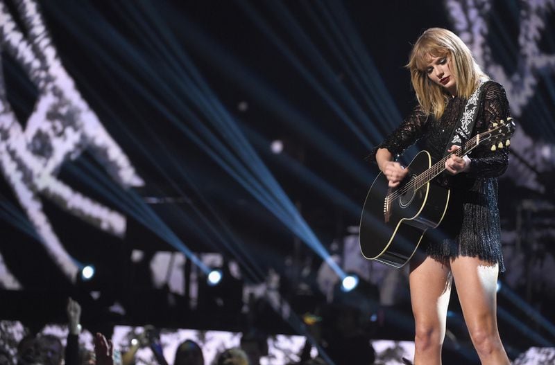  Taylor tones it down with an acoustic set. (Photo by Kevin Winter/Getty Images for DIRECTV)