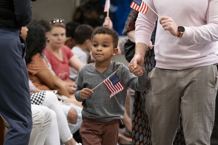 August Dostal-Muncy came to see his Godfather become a naturalized citizen during a ceremony  at The Carter Center in Atlanta on Sunday, Oct. 1, 2023. The ceremony was held at the center in honor of President Jimmy Carter’s 99th birthday.   (Ben Gray / Ben@BenGray.com)