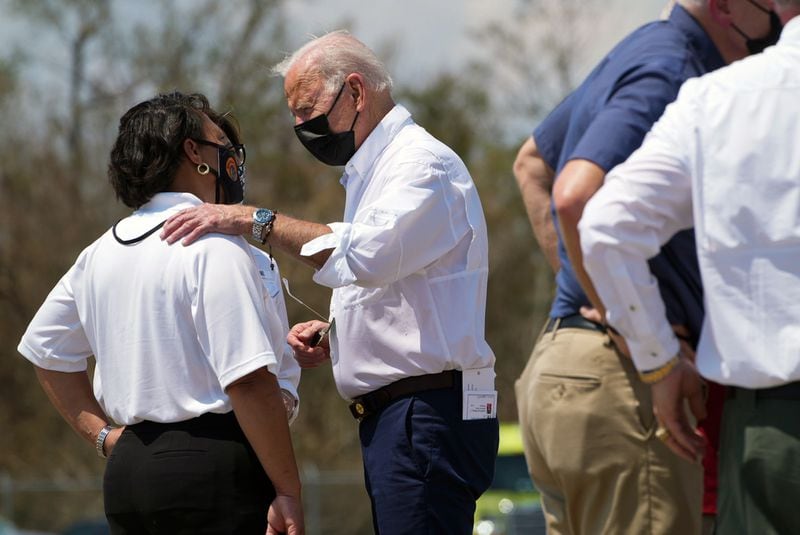 President Joe Biden is greeted by local officials upon his arrival in New Orleans on Friday. Biden’s trip is part of an effort to demonstrate his commitment to the federal government’s storm response even as his administration remains enmeshed in other pressing matters. (Sarahbeth Maney/The New York Times)