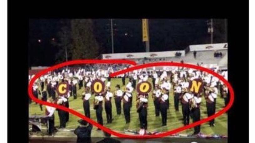 During the halftime show on Friday,  some members of the Brookwood High School marching band used instrument covers to spell out a racially insensitive word.