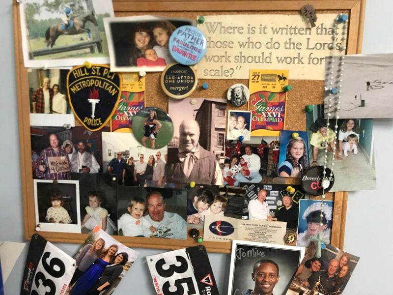 A bulletin board of keepsakes Mike Pniewski has in his basement office in his Acworth home. CREDIT: Rodney Ho/rho@ajc.com