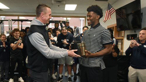 Atlanta Falcons quarterback Matt Ryan (left) surprises Marietta tight end Arik Gilbert with the 2019-20 Gatorade National Football Player of the Year award Tuesday, Dec. 17, 2019, at Marietta High School in Marietta. Gatorade Player of the Year program recognizes the natio's most outstanding high school student-athletes for their athletic excellence, academic achievement and exemplary character.