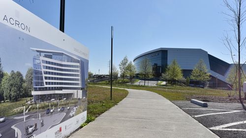 April 5, 2016 Hapeville - With the Porsche Experience Center in the background, future Solis Hotel picture is displayed during a groundbreaking ceremony for Solis Hotel Two Porsche Drive next to the Porsche Experience Center on Tuesday, April5, 2016. The rise of the high-end hotel Solis next to the Porsche North America headquarters marks one of the highest-profile hopes that the dream of an aerotropolis could be possible. Southside businesses, political and community leaders have long-held onto the idea that the airport area could become a thriving business district like Buckhead or Perimeter. HYOSUB SHIN / HSHIN@AJC.COM
