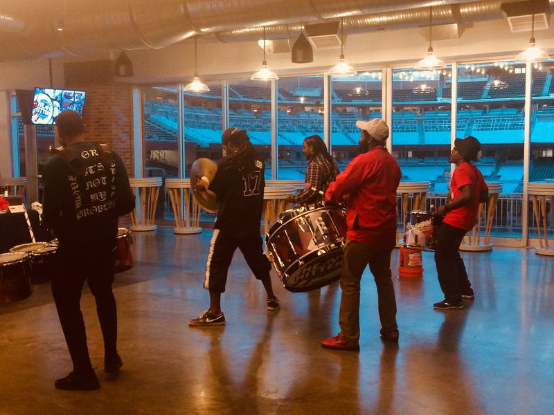 During the preliminary round of auditions, hopefuls selected two different types of drums to play for a panel of judges, then were asked to do other things — including, seen here, being joined for an impromptu routine by veteran members of the Heavy Hitters team who’d shown up to help out. The auditions took place in the Chop House inside SunTrust Park in February. JILL VEJNOSKA / JVEJNOSKA@AJC.COM