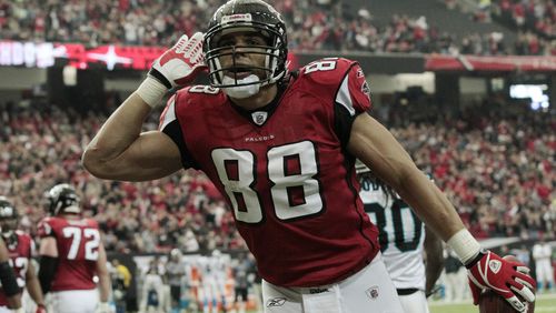 Atlanta Falcons tight end Tony Gonzalez reacts after scoring a touchdown against the Carolina Panthers in the first half of an NFL football game at the Georgia Dome in Atlanta Sunday, Jan. 2, 2011. (AP Photo/Dave Martin)