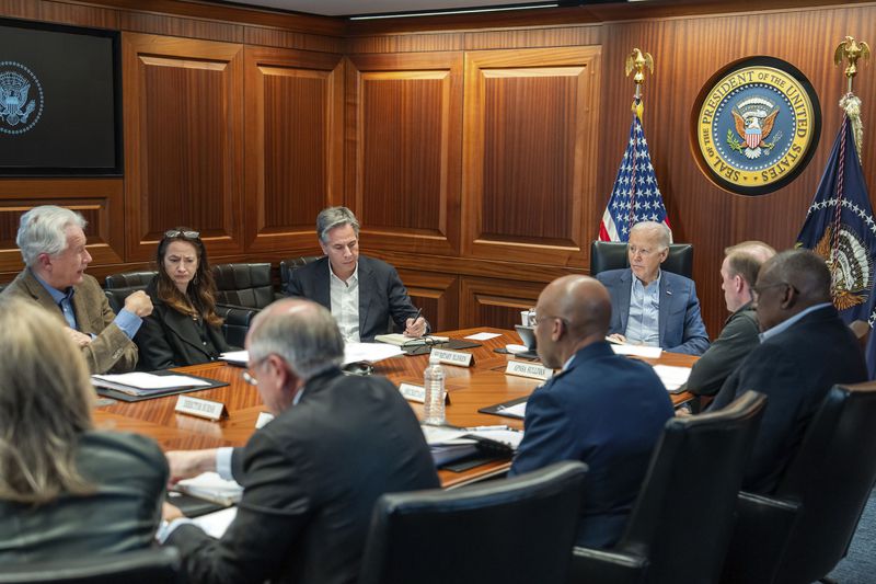 In this image released by the White House, President Joe Biden, along with members of his national security team, receive an update on an ongoing airborne attack on Israel from Iran, as they meet in the Situation Room of the White House in Washington, Saturday, April 13, 2024. From l-r., facing Biden are, Central Intelligence Agency Director William Burns, Avril Haines, Director of National Intelligence, Secretary of State Antony Blinken, and National Security Advisor Jake Sullivan. (Adam Schultz/The White House via AP)