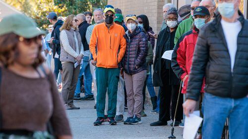 Dekalb County voters wait in line to vote early at Tucker-Reid H. Cofer Library in Tucker on Nov. 29, 2022. (Arvin Temkar/AJC)