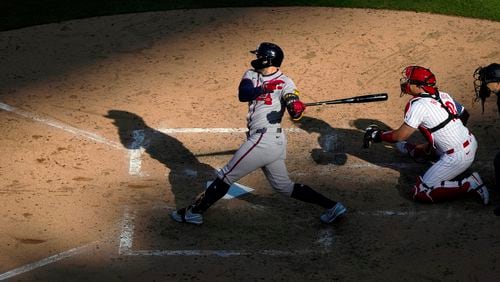 Atlanta Braves' Adam Duvall hits double two-run double off of Philadelphia Phillies' Jeff Hoffman during the seventh inning of an opening-day baseball game, Friday, March 29, 2024, in Philadelphia. (AP Photo/Matt Rourke)