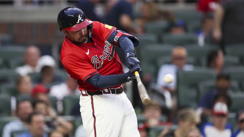Atlanta Braves catcher Travis d'Arnaud hits a solo home run during the second inning against the Texas Rangers at Truist Park, Friday, April 19, 2024, in Atlanta. (Jason Getz / AJC)
